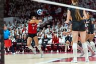 Rodriguez (in red) for Nebraska Cornhuskers during a match against Wisconsin (Image via: Getty Images)